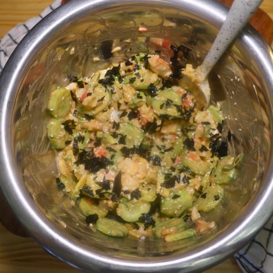 Overhead image of California Roll Cucumber Salad in a metal bowl