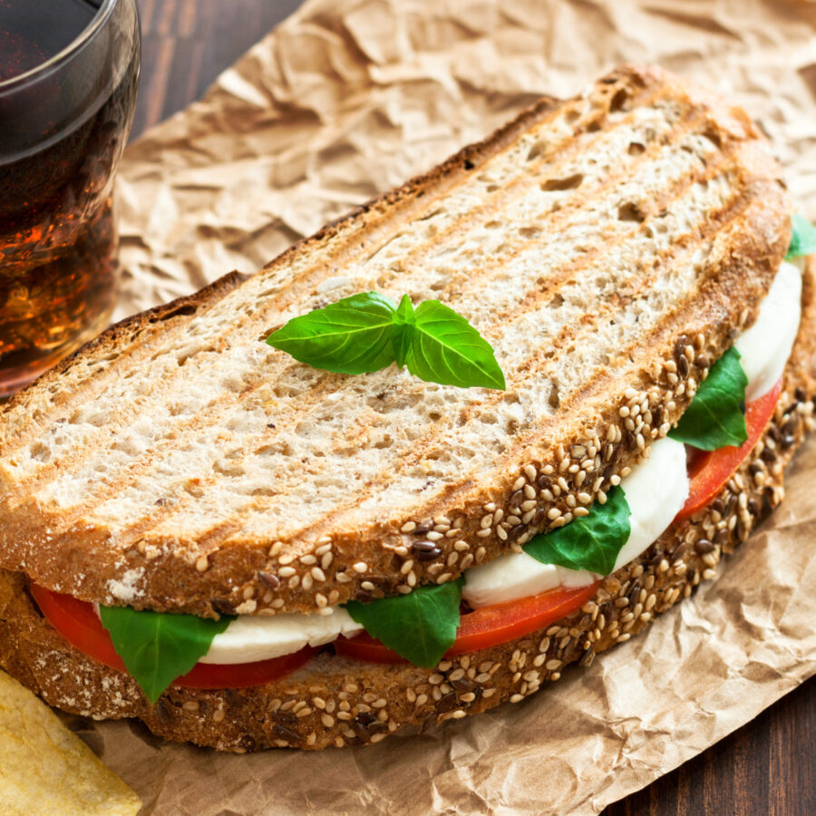 Overhead image of a Caprese Sandwich on parchment paper