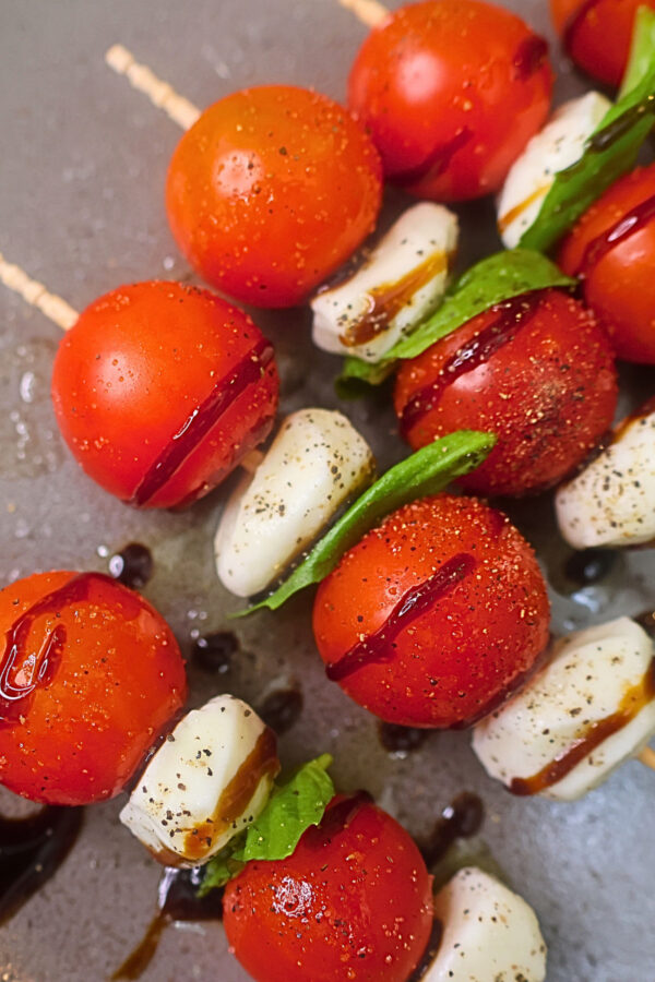 Close up image of Caprese skewers on a plate