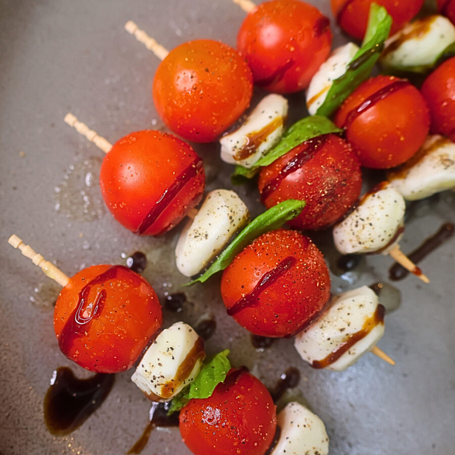 Close up image of Caprese skewers on a plate