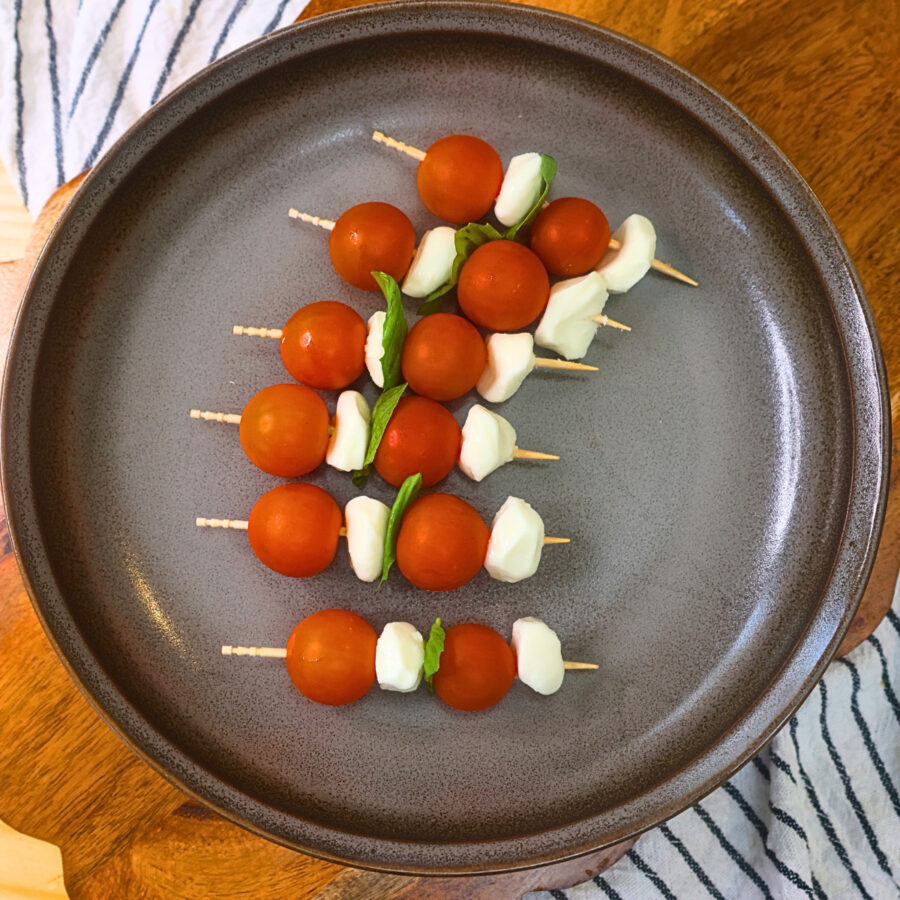 Overhead image of assembled Caprese Skewers on a plate