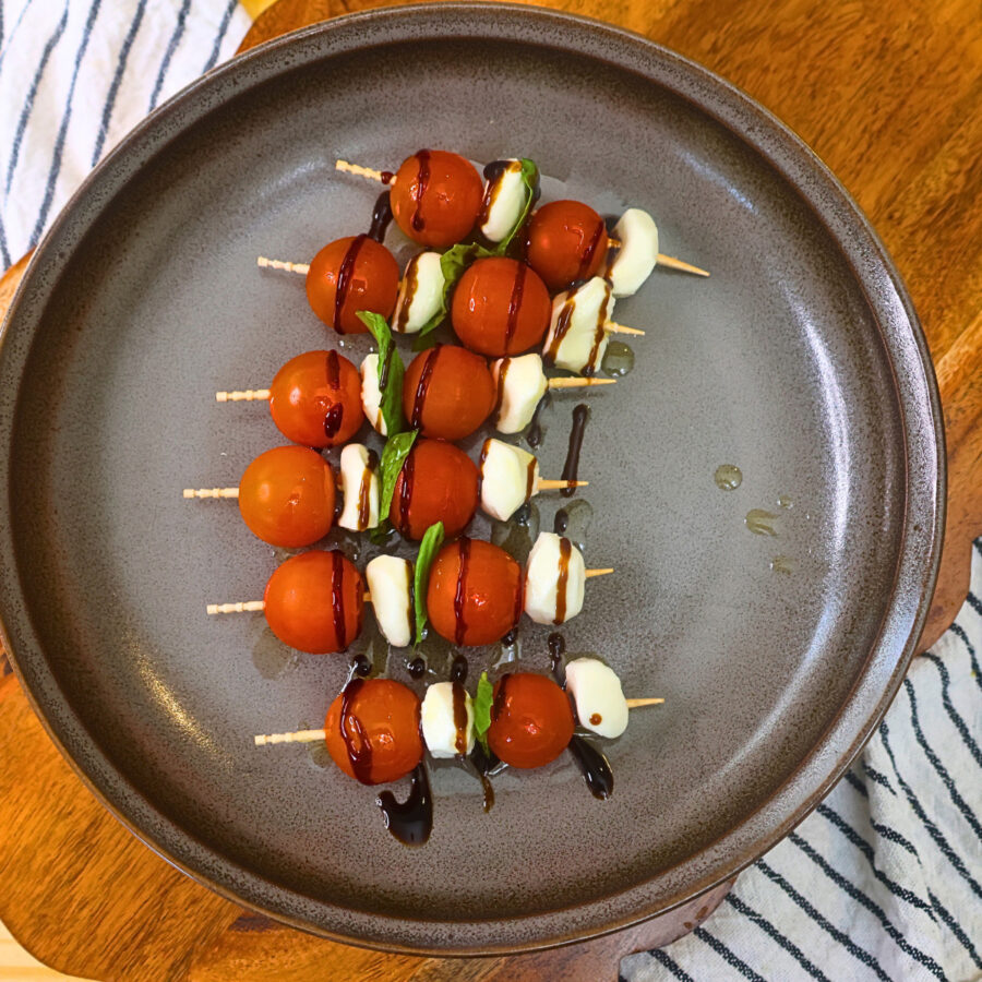 Caprese Skewers drizzled with olive oil and balsamic glaze