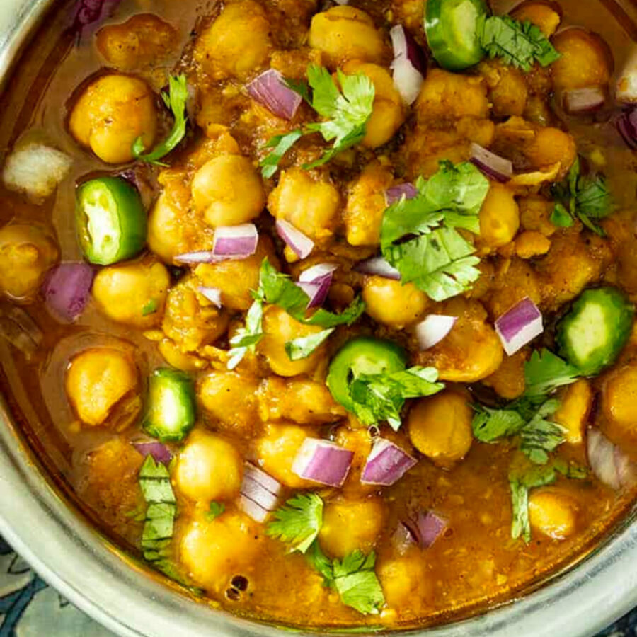 Overhead image of chana masala in a decorative bowl