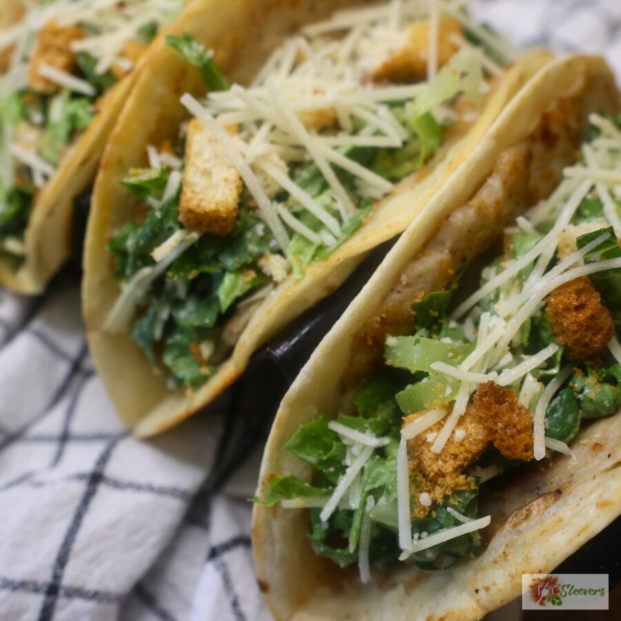 Assembled Chicken Caesar Smash Tacos in a taco holder