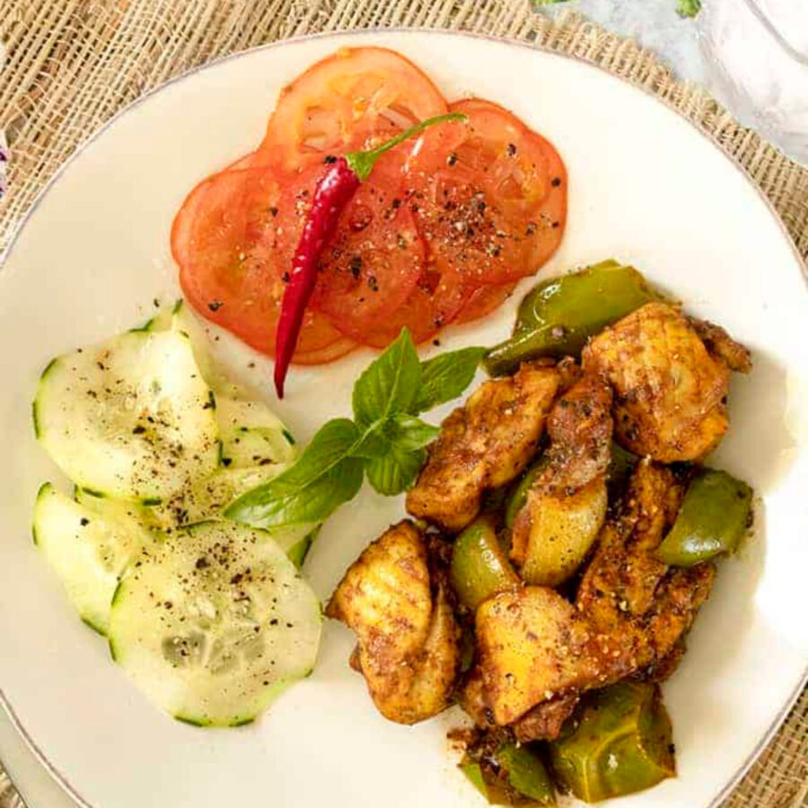 Overhead image of Chicken Jalfrezi with vegetable sides