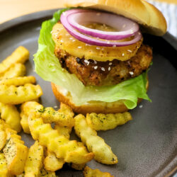 Asian cuisine Air Fryer Chicken Teriyaki Burger on a plate with french fries