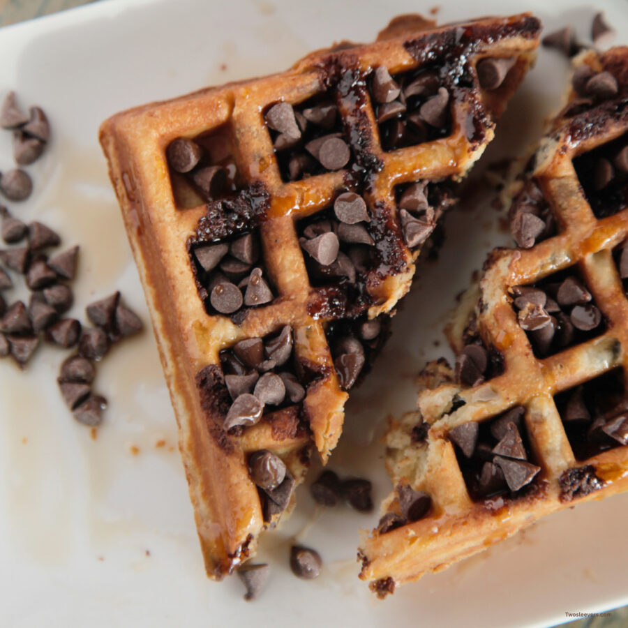 Overhead image of chocolate chip waffles cut in half