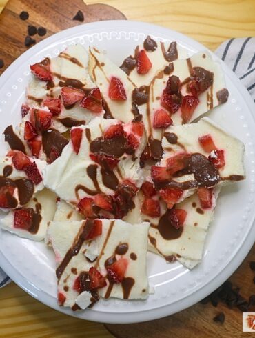 Overhead image of Chocolate Strawberry Yogurt Bark broken into pieces in a white bowl
