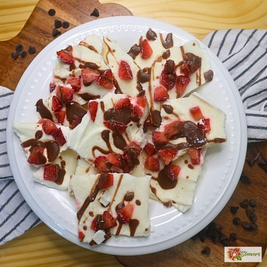 Overhead image of Chocolate Strawberry Yogurt Bark broken into pieces in a white bowl