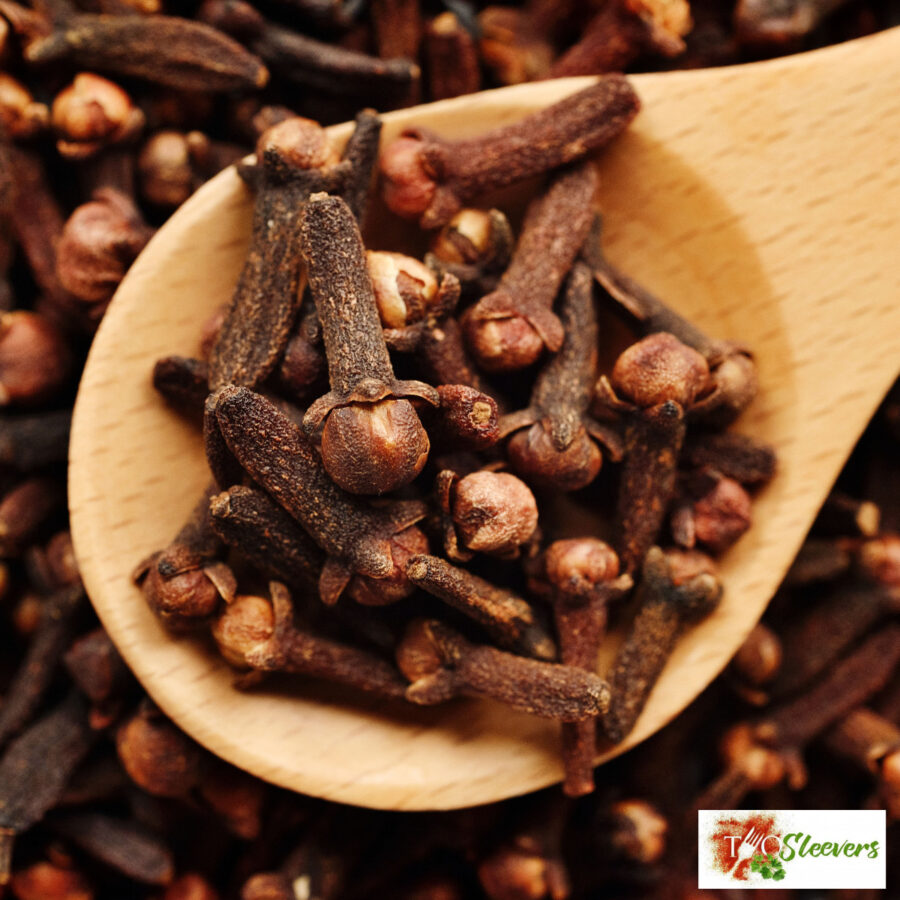 Close up image of Cloves on a wooden spoon