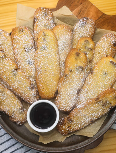Overhead image of Cookie fries stacked on a plate with dipping chocolate