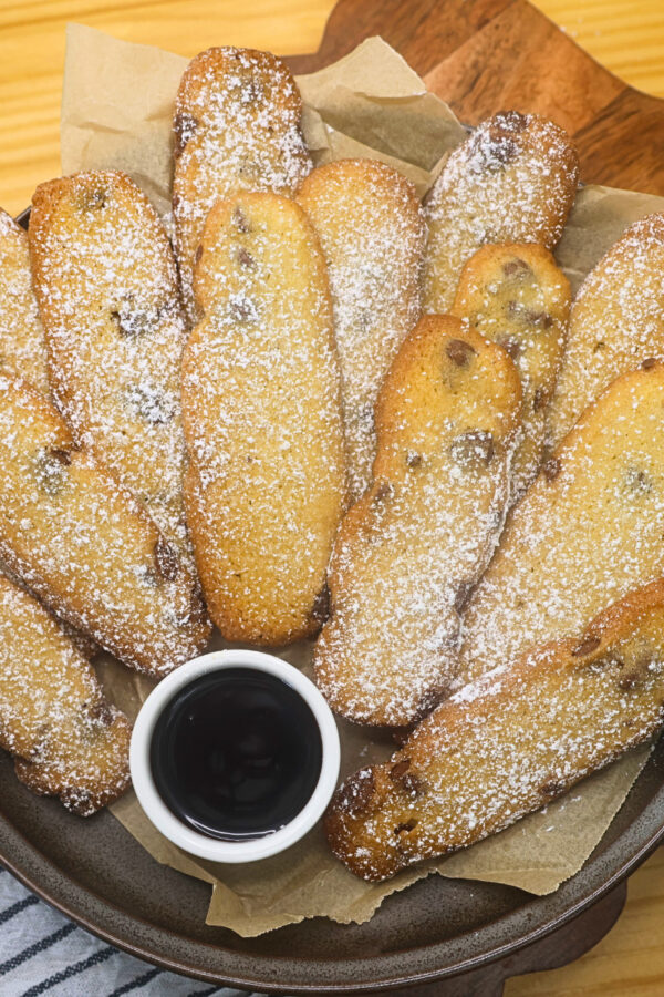 Overhead image of Cookie fries stacked on a plate with dipping chocolate