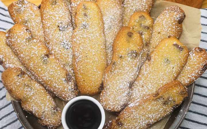 Overhead image of Cookie fries stacked on a plate with dipping chocolate