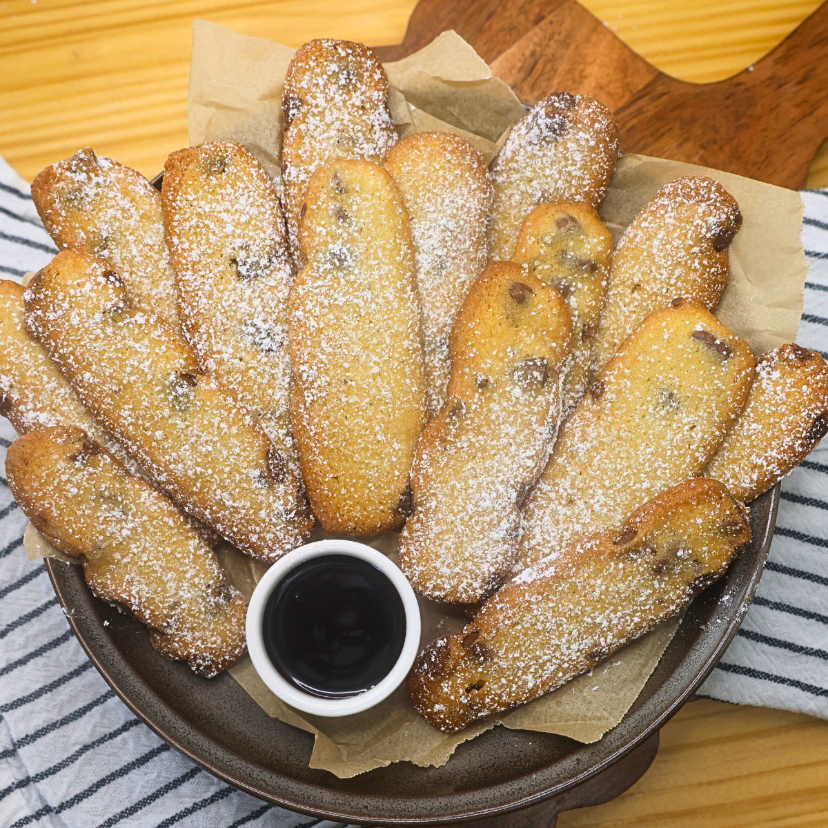 Overhead image of Cookie fries stacked on a plate with dipping chocolate