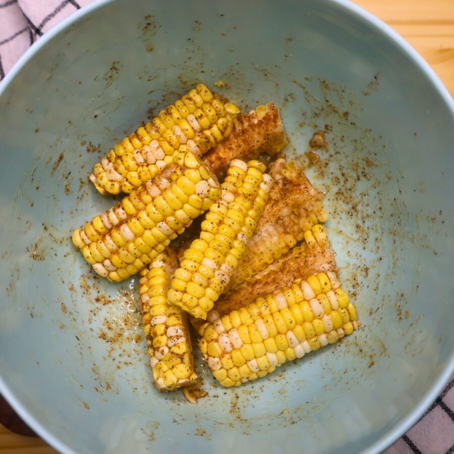 seasoned corn ribs in a blue bowl