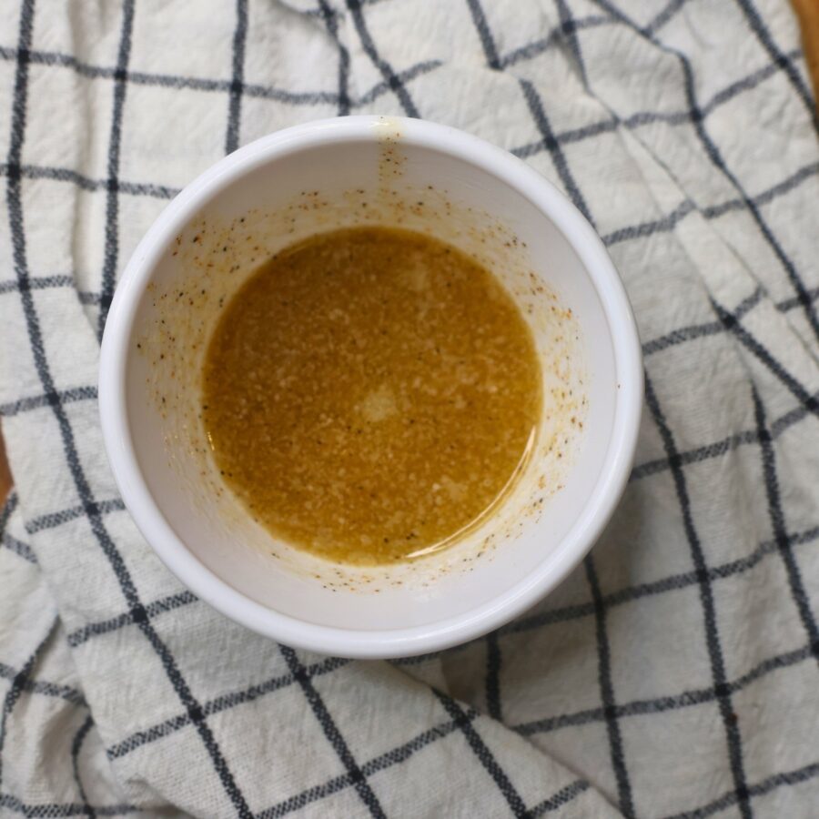 Overhead image of homemade Cajun butter in a white bowl