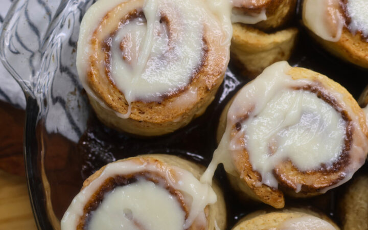 Close up image of cottage cheese cinnamon rolls in a pan
