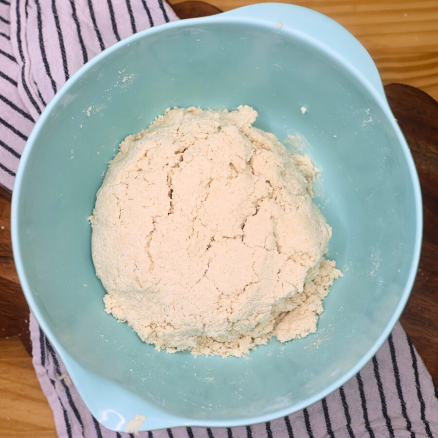 Cottage cheese cinnamon roll dough in a blue bowl