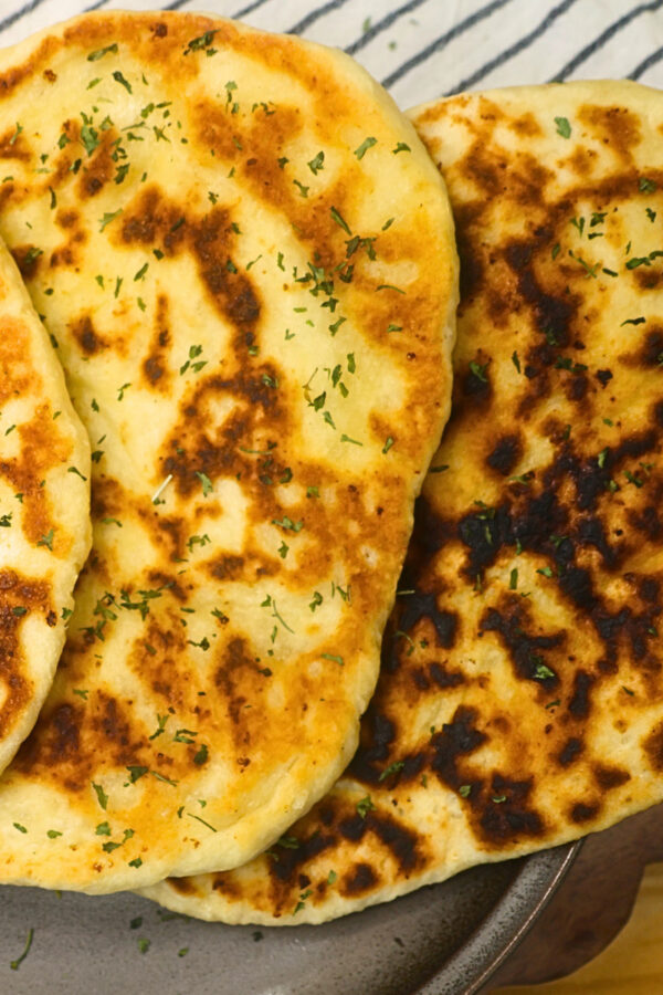 Close up image of cottage cheese flatbread stacked on a plate