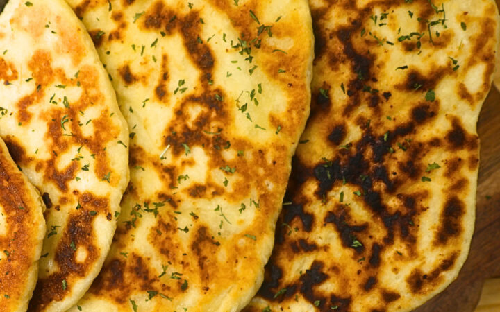 Close up image of cottage cheese flatbread stacked on a plate