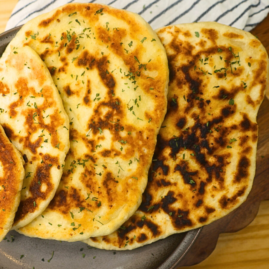 Close up image of cottage cheese flatbread stacked on a plate