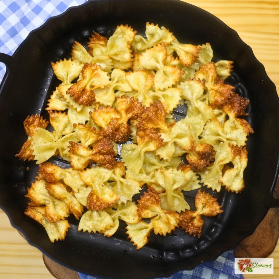 Crispy bow tie pasta in an air fryer basket