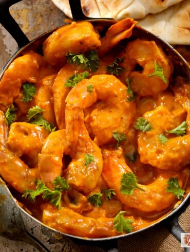 Overhead image of Curry Shrimp in a pan with cilantro for garnish