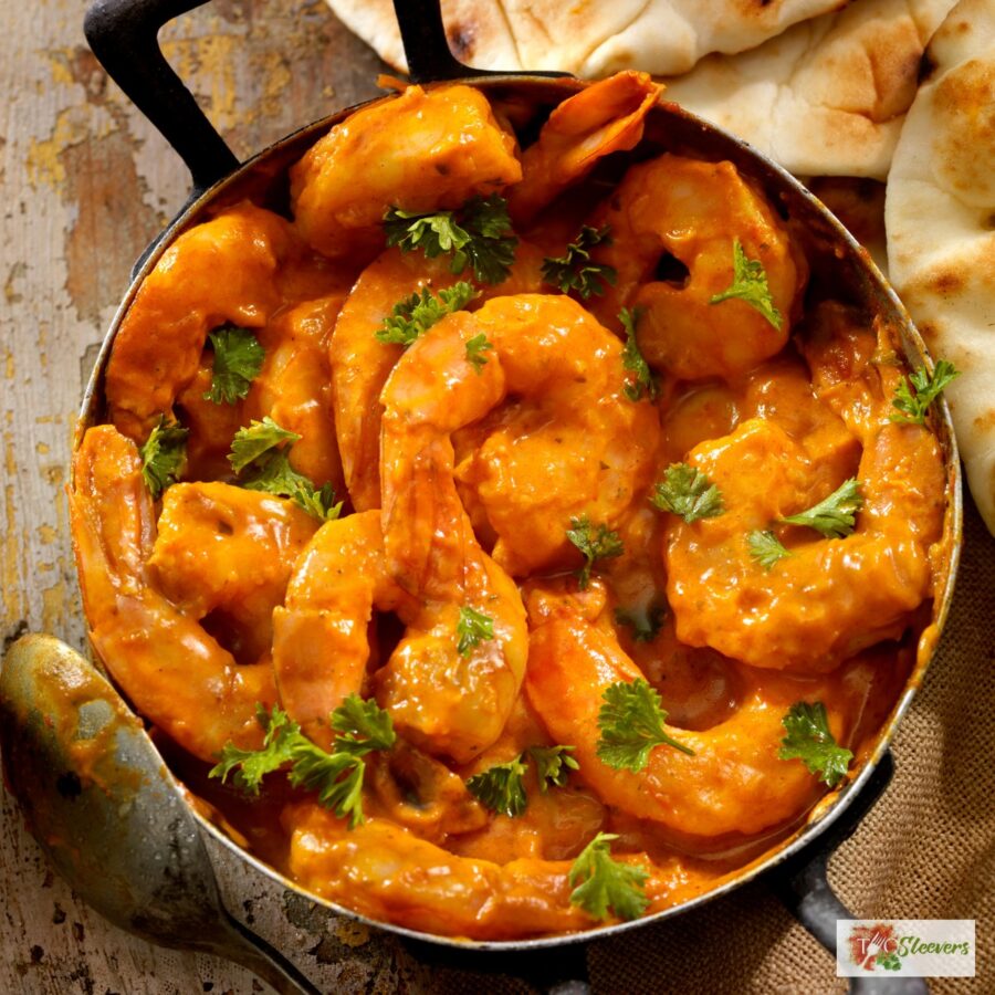 Overhead image of Curry Shrimp in a pan with cilantro for garnish