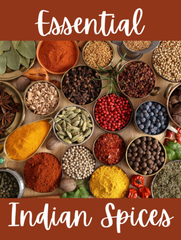 Essential Indian Spices in small bowls with text overlay