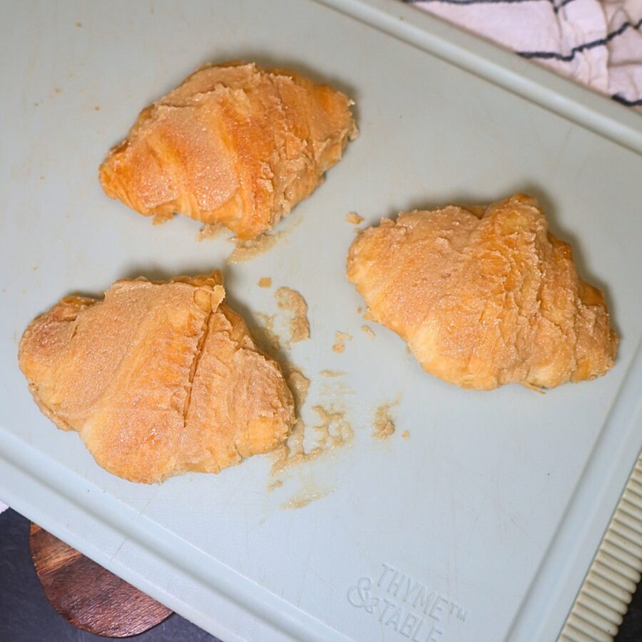 Flattened croissants coated in sweetened butter