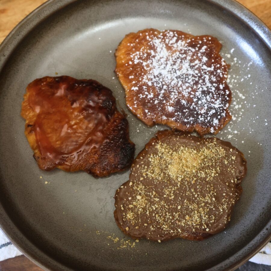 Three different flavored flat croissants on a plate