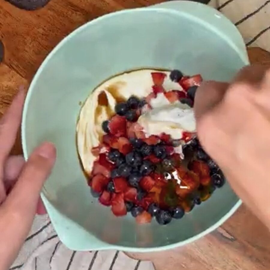 Greek yogurt, strawberries, vanilla, and honey in a bowl