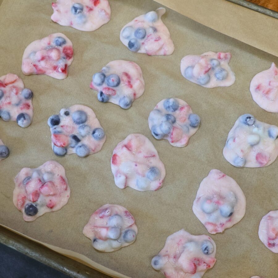 Frozen Yogurt fruit clusters on parmchment paper
