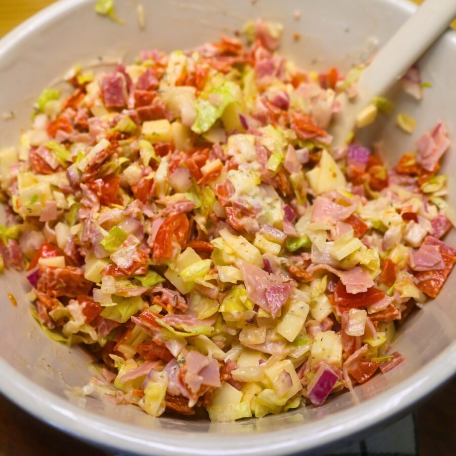 Hoagie Dip combined with homemade dressing in a bowl