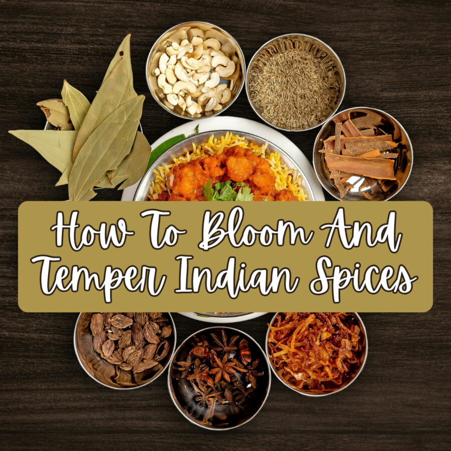 A serving dish of curry with small bowls of spices surrounding it. Text overlay reading "How To Bloom and Temper Indian Spices"