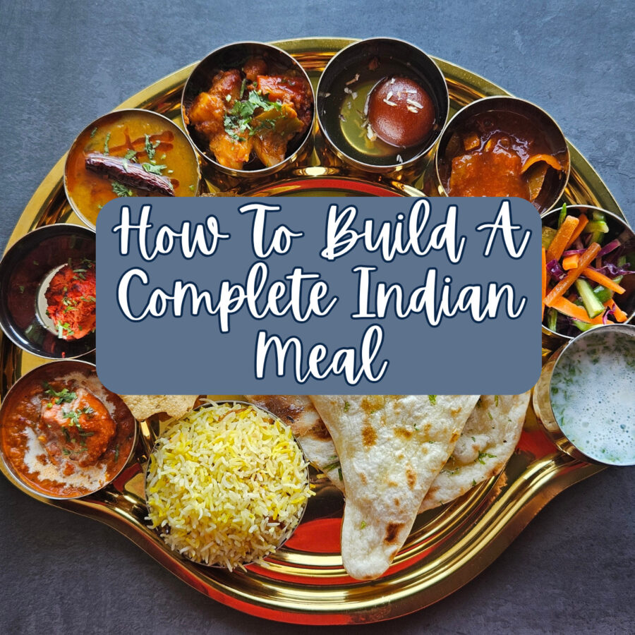 Large Indian Meal on a serving platter with text overlay reading "How To Build A Complete Indian Meal"