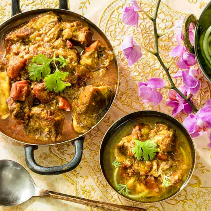 Overhead image of two dishes full of Indian Curry