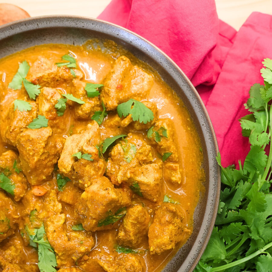 Close up image of Instant Pot Chicken Tikka Masala with cilantro garnish