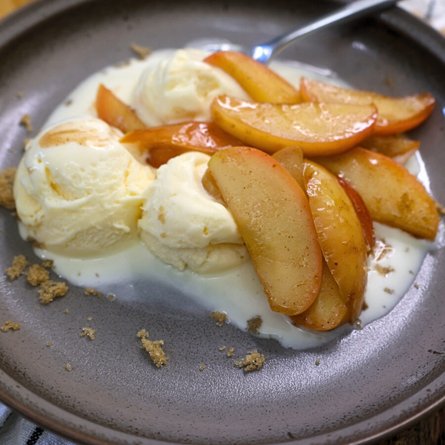 Close up image of Instant Pot Cinnamon Apples on vanilla ice cream