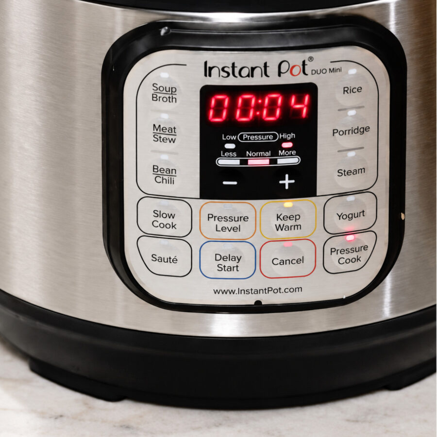 An Instant Pot with a timer reading 4 minutes