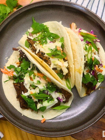 Overherad image of three Instant Pot Korean Beef Tacos on a plate
