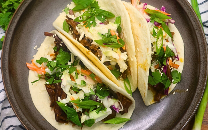 Overherad image of three Instant Pot Korean Beef Tacos on a plate