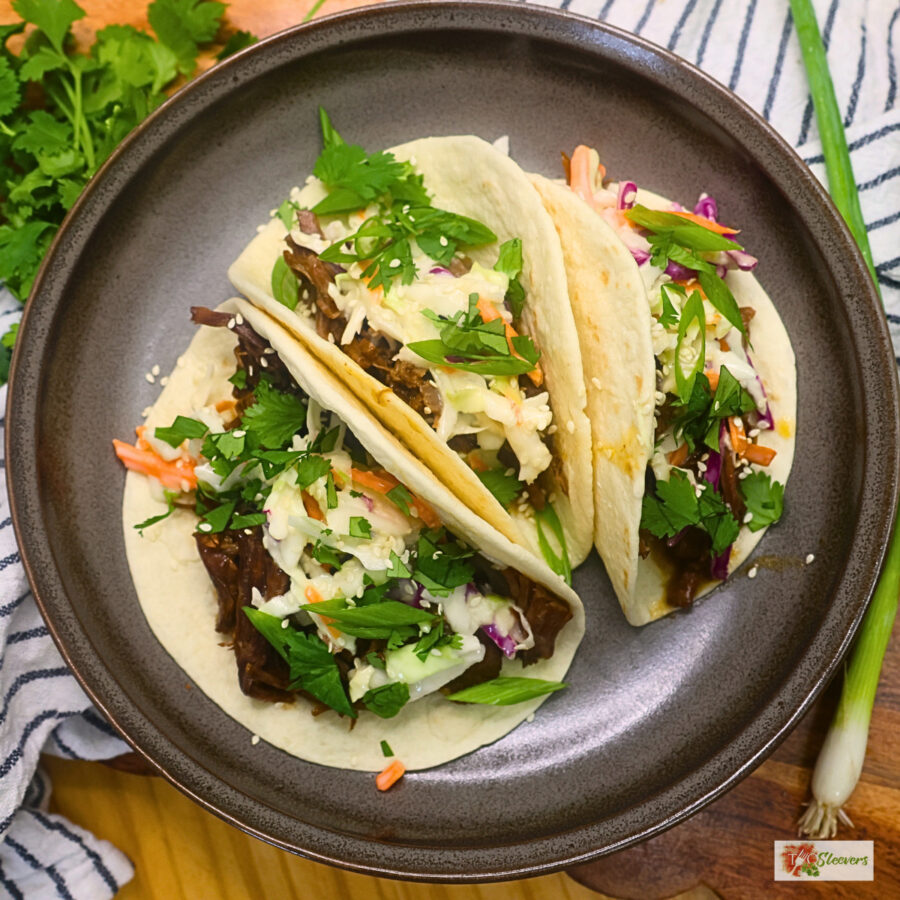 Overherad image of three Instant Pot Korean Beef Tacos on a plate