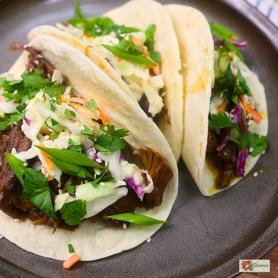 Close up image of Instant Pot Korean Beef Tacos on a plate