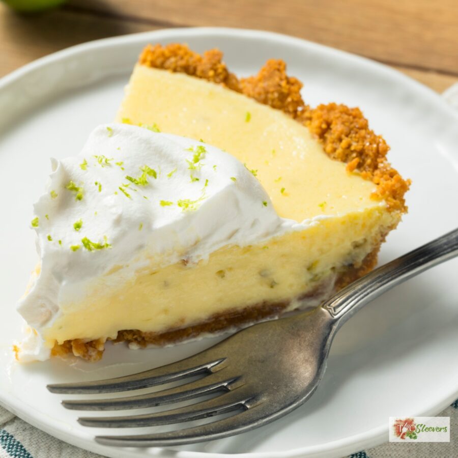 A slice of Key Lime Pie on a plate with a fork