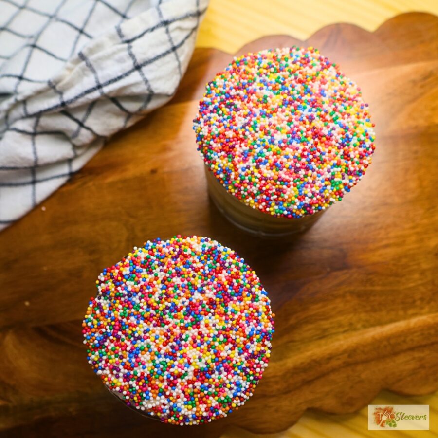 Overhead image of two mini dot cakes with sprinkle topping
