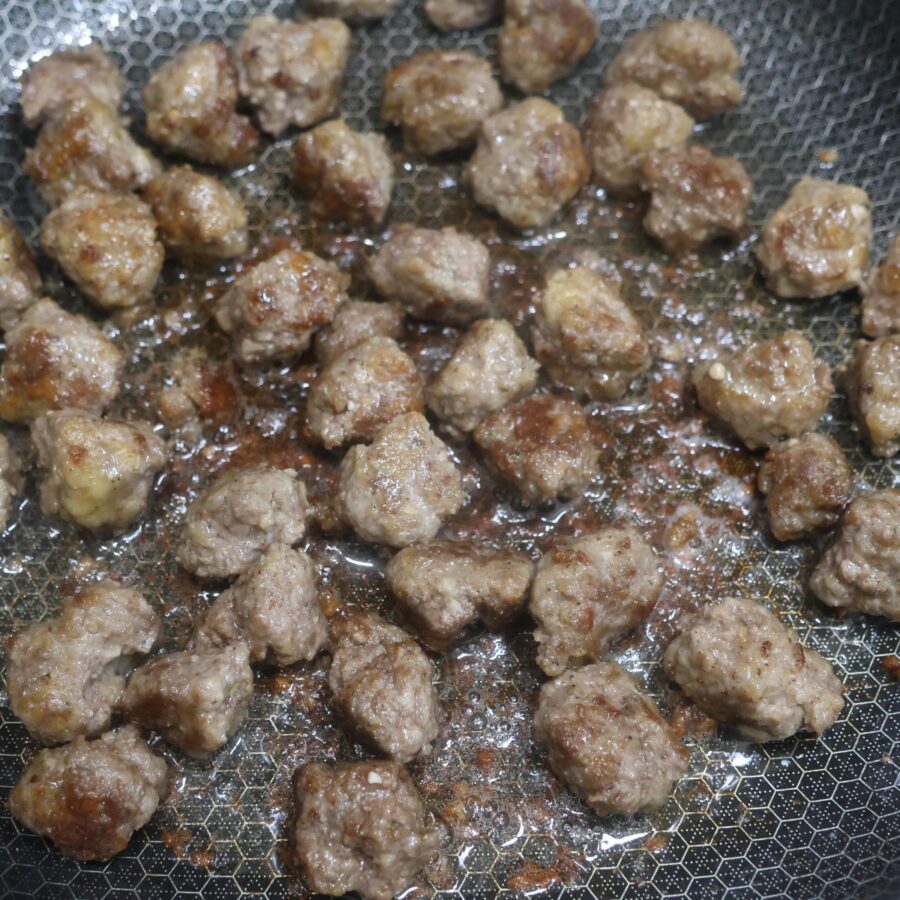 Mini meatballs cooked in a skillet