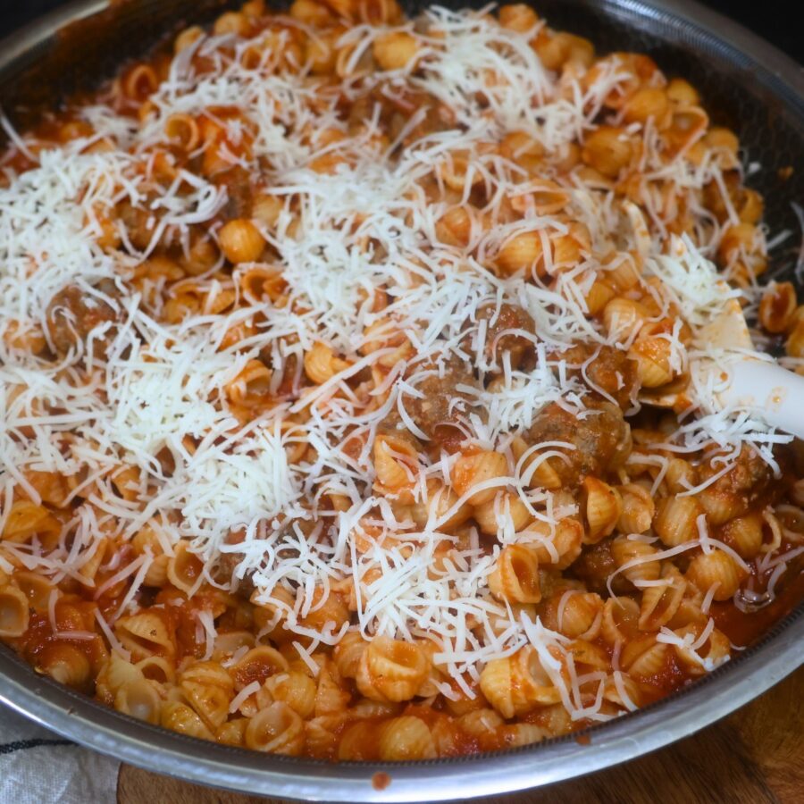 Mini Meatball Pasta in a skillet with cheese on top