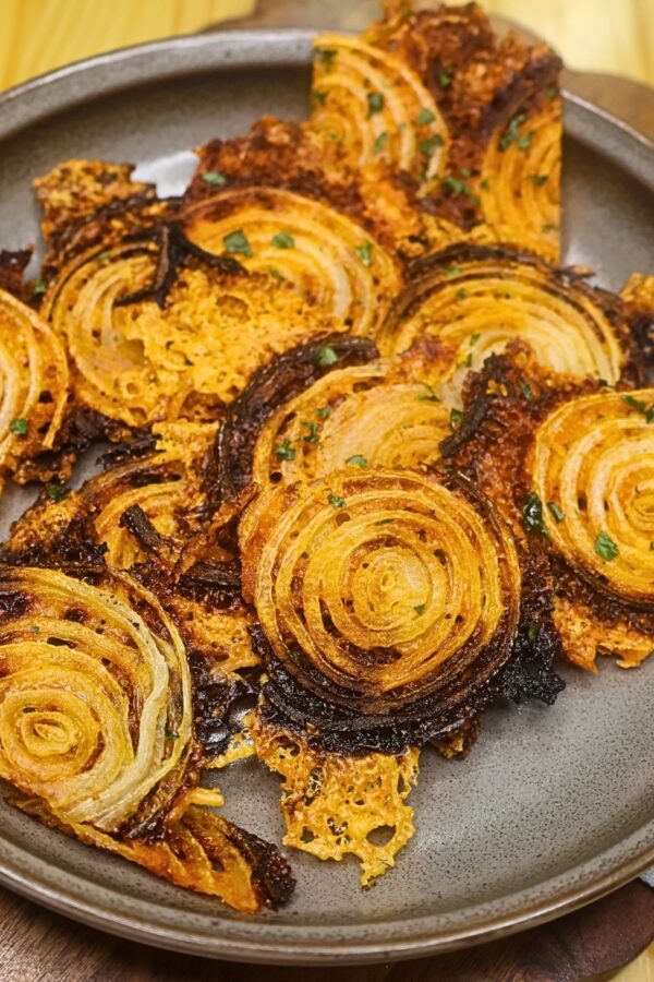 Overhead image of onion chips on a plate