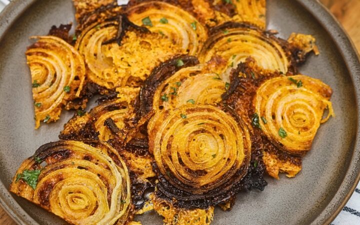 Overhead image of onion chips on a plate